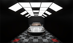 Spacious car detailing studio featuring grey and black checkered tiles and bright vertical wall lighting